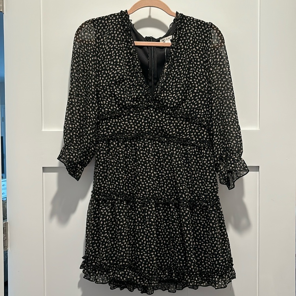 Francesca’s black ruffle mini dress w quarter sleeve